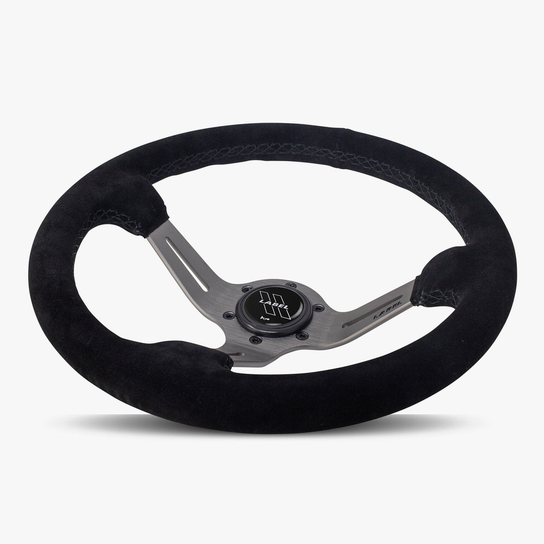 The Le Mans | Black Alcantara Suede | Graphite Spoke | Black Stitch